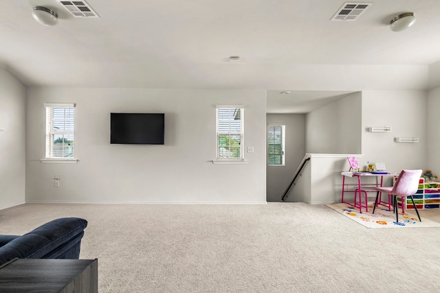 rec room featuring a wealth of natural light and carpet