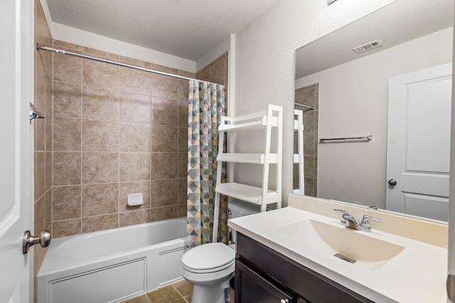 full bathroom with vanity, a textured ceiling, shower / tub combo, tile patterned flooring, and toilet