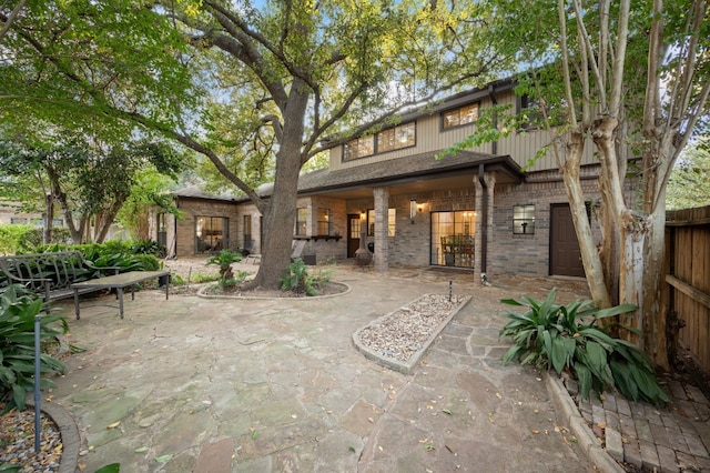 back of house featuring a patio area