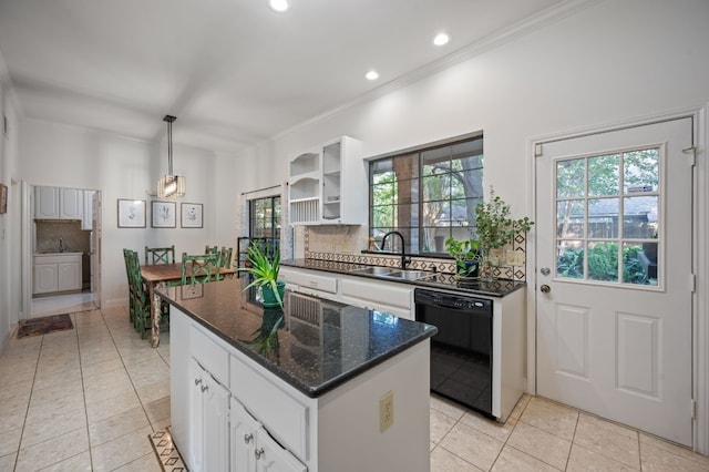 kitchen featuring a center island, black dishwasher, sink, backsplash, and white cabinetry