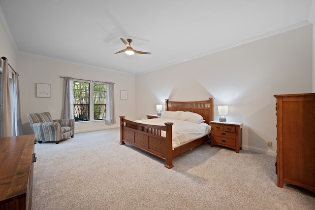 bedroom featuring ceiling fan, light carpet, and crown molding