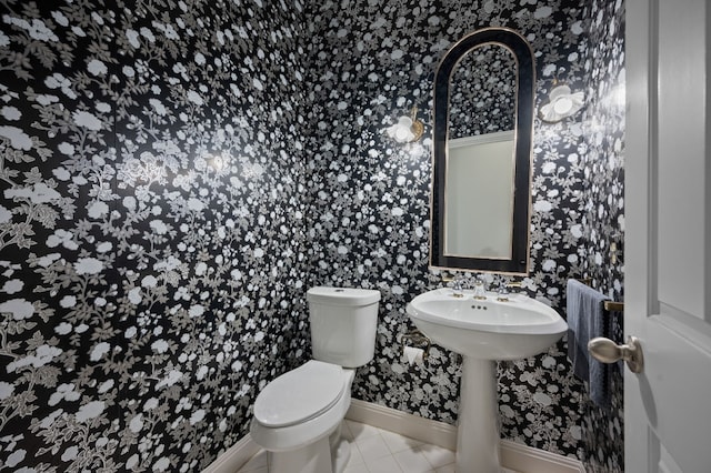 bathroom featuring tile patterned floors and toilet