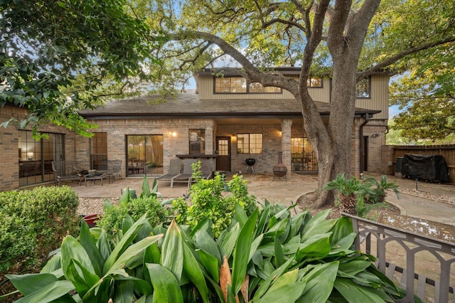 back of house with a patio area