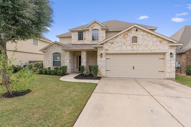 view of front of property featuring a front yard and a garage