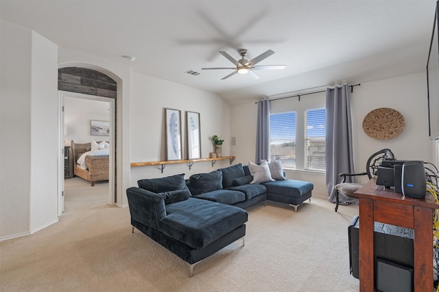 carpeted living room featuring ceiling fan