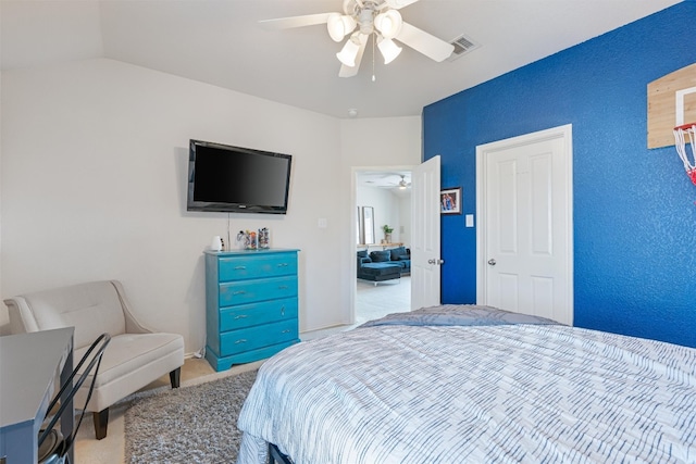 carpeted bedroom featuring ceiling fan and lofted ceiling