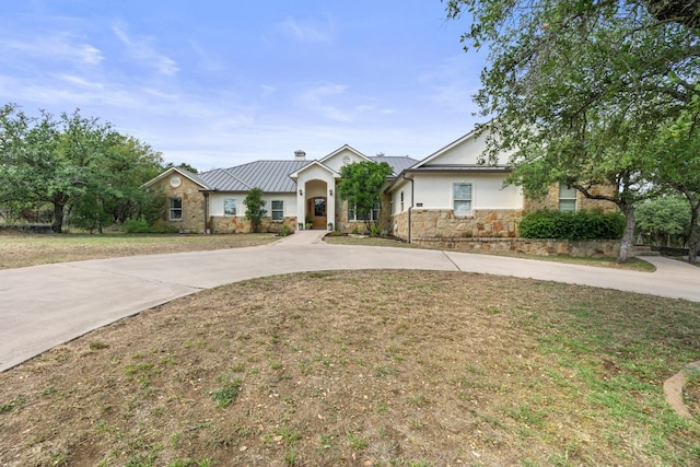 ranch-style home with a front lawn