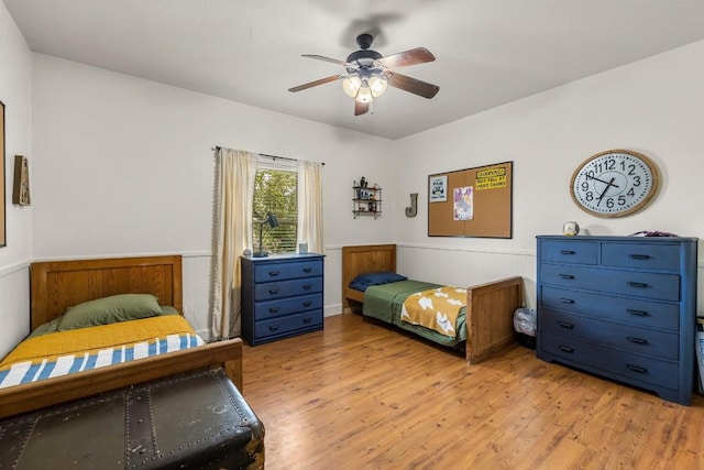 bedroom featuring light hardwood / wood-style flooring and ceiling fan