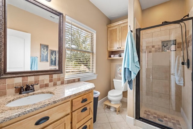 bathroom featuring an enclosed shower, backsplash, tile patterned flooring, and vanity