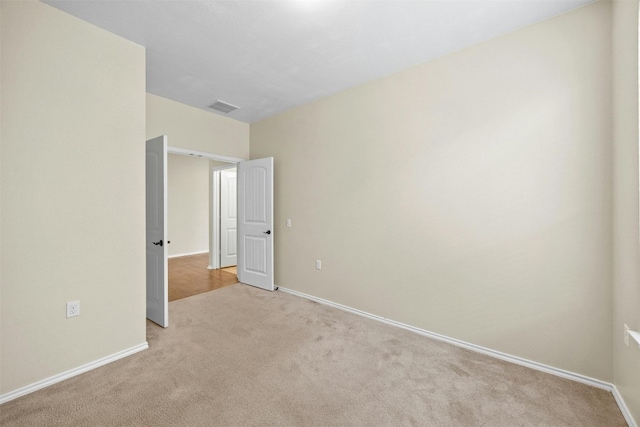 unfurnished bedroom with light carpet