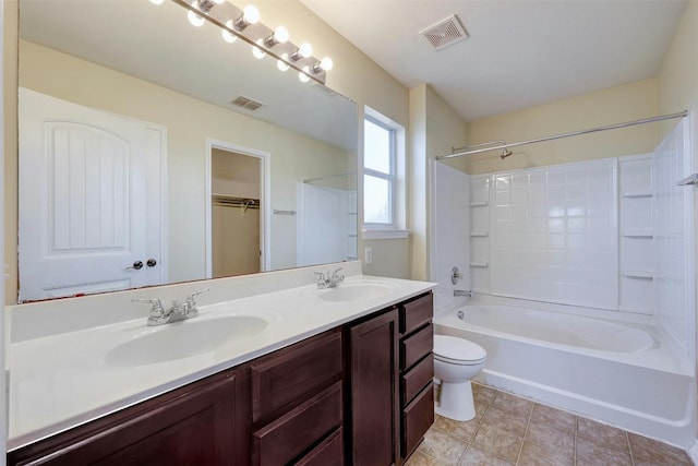 full bathroom with vanity, washtub / shower combination, and toilet