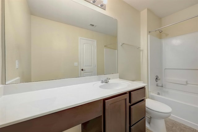 full bathroom featuring vanity, shower / tub combination, tile patterned floors, and toilet