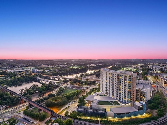 aerial view at dusk with a water view