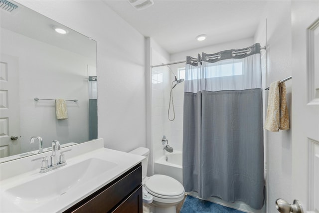 full bathroom featuring toilet, vanity, and shower / bath combo with shower curtain