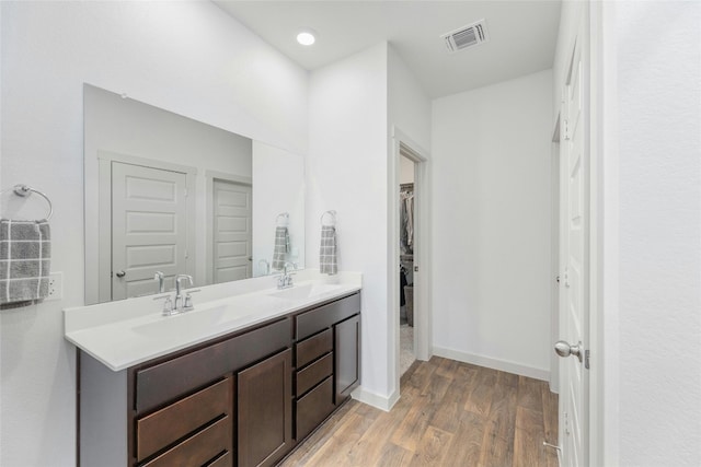 bathroom featuring vanity and wood-type flooring