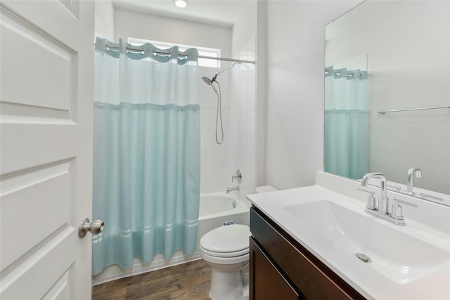 full bathroom with wood-type flooring, vanity, toilet, and shower / bath combination with curtain