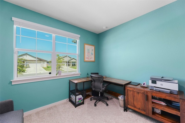 carpeted home office featuring a wealth of natural light