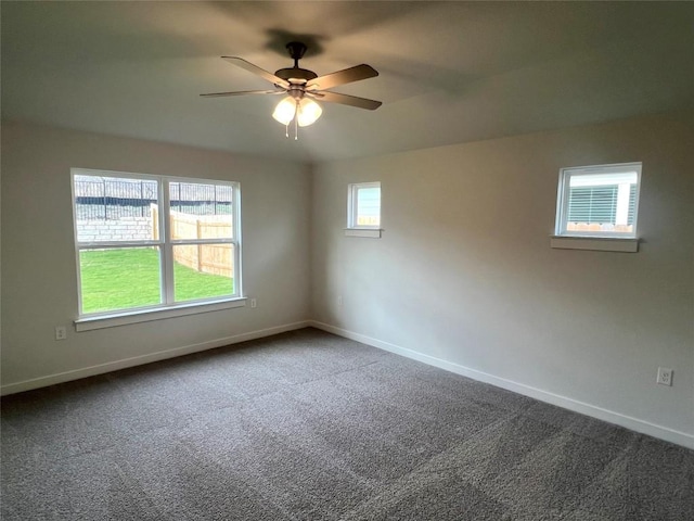 carpeted empty room with ceiling fan