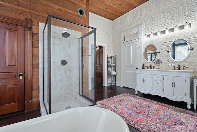 bathroom with wood-type flooring, vanity, wood ceiling, wooden walls, and separate shower and tub