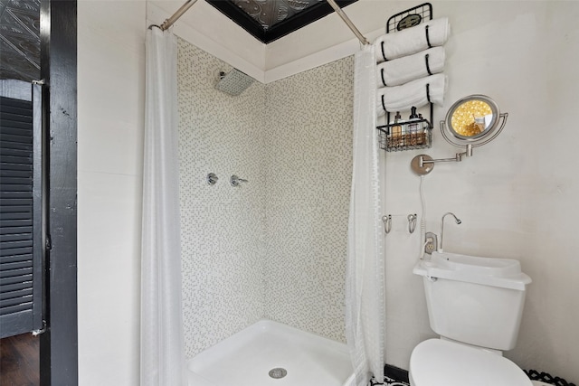 bathroom with walk in shower and toilet