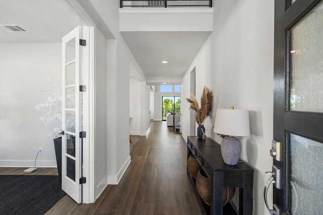 hall with dark wood-type flooring