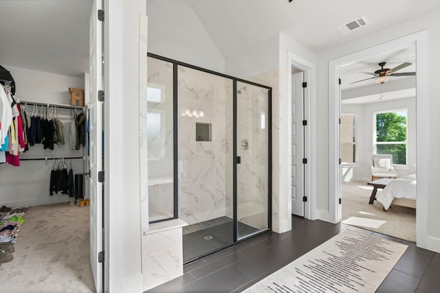 bathroom featuring ceiling fan, an enclosed shower, and lofted ceiling