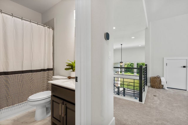 bathroom featuring toilet and vanity