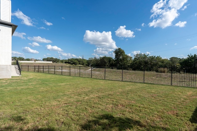 view of yard with a rural view