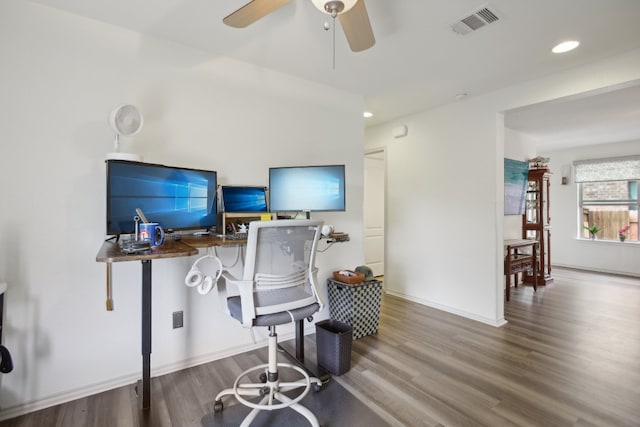 home office with hardwood / wood-style flooring and ceiling fan