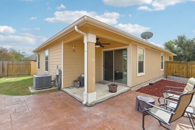 back of house featuring central AC unit, ceiling fan, and a patio