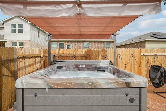 view of patio with a hot tub