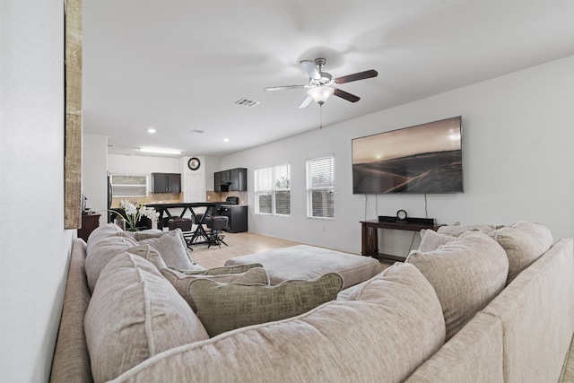 living room with ceiling fan