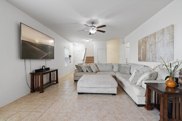 living room with ceiling fan and light tile patterned floors