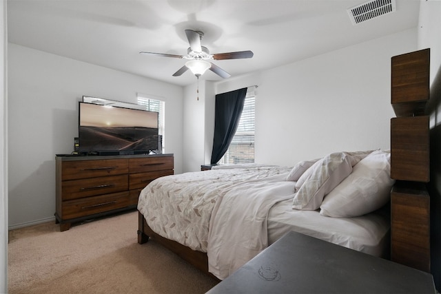 bedroom featuring ceiling fan and light colored carpet