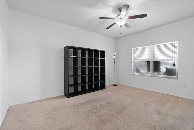 spare room with carpet flooring and ceiling fan