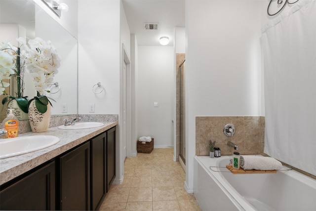 bathroom featuring tile patterned flooring, vanity, and plus walk in shower