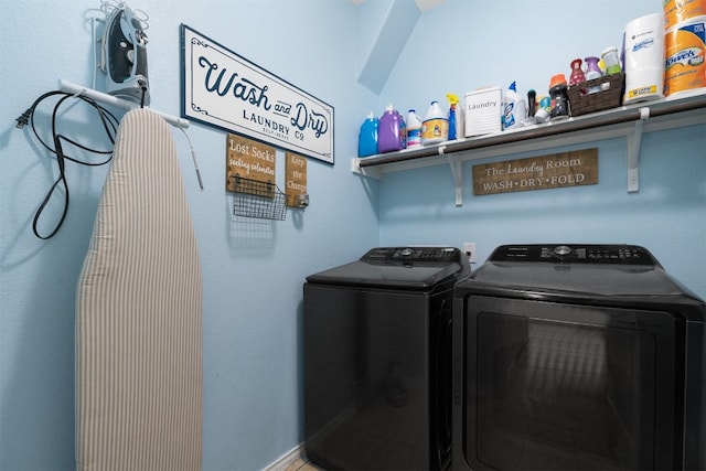 clothes washing area with washer and dryer