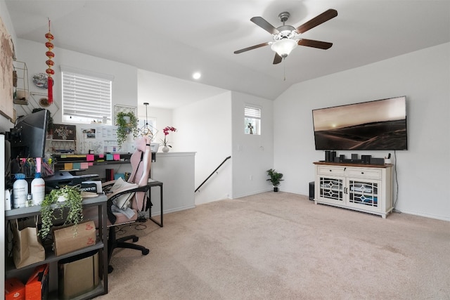 office space featuring carpet floors, ceiling fan, and lofted ceiling