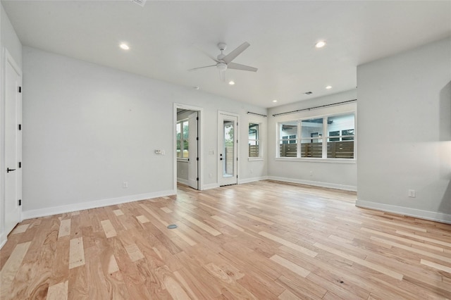 unfurnished living room featuring light wood-type flooring and ceiling fan