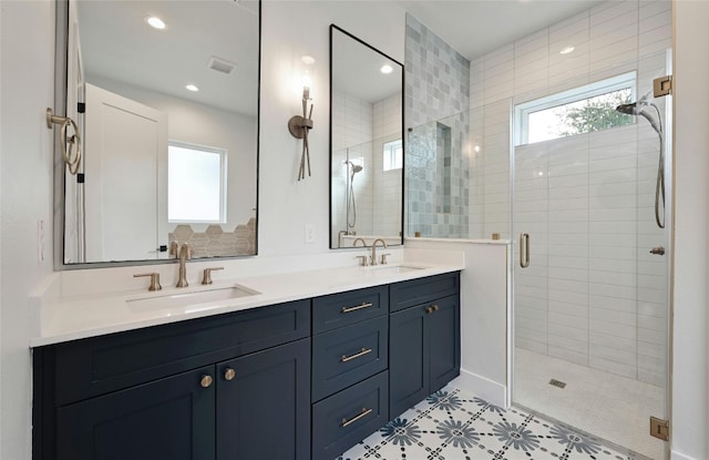 bathroom with an enclosed shower and vanity