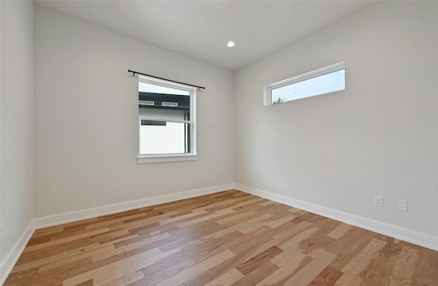 unfurnished room featuring light hardwood / wood-style flooring