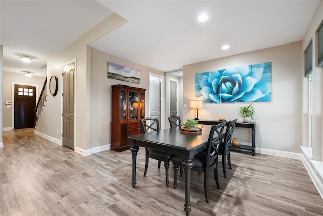 dining room with light hardwood / wood-style flooring