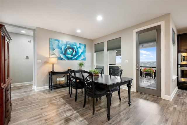 dining area with light hardwood / wood-style flooring