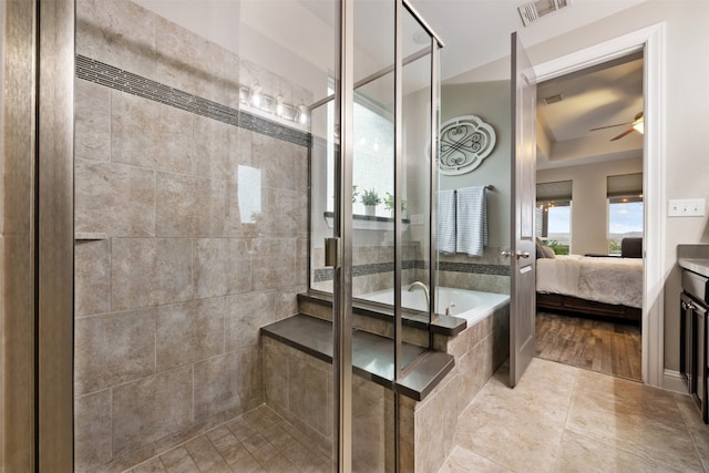 bathroom with vanity, hardwood / wood-style floors, ceiling fan, and separate shower and tub