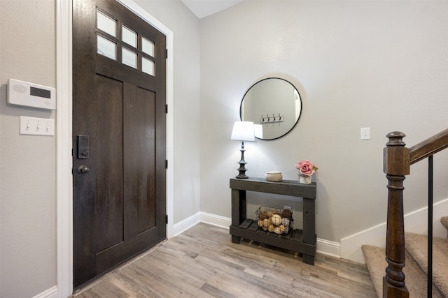 foyer with light hardwood / wood-style flooring