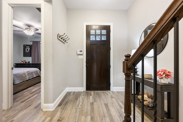 entrance foyer featuring ceiling fan and light wood-type flooring