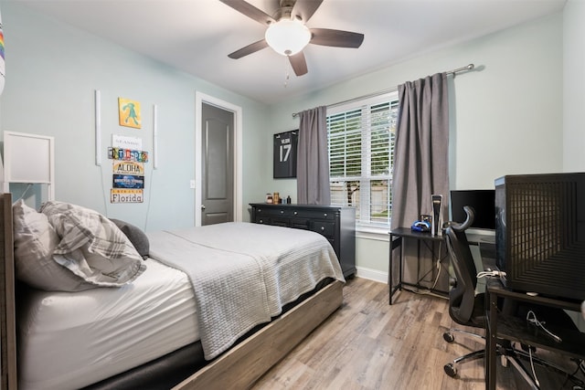 bedroom with hardwood / wood-style floors and ceiling fan