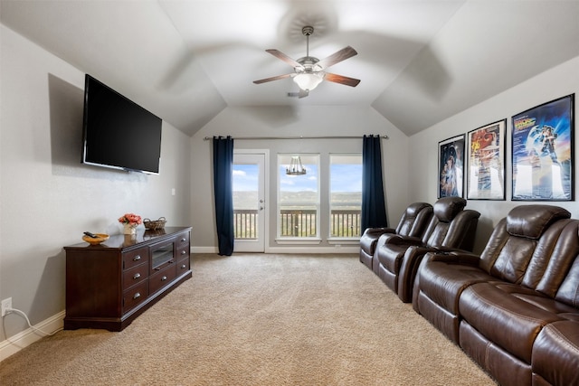 home theater room featuring light carpet and lofted ceiling