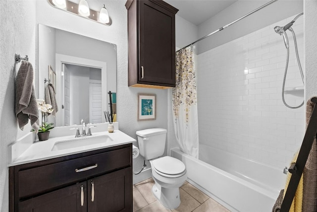 full bathroom featuring toilet, shower / bath combo, vanity, and tile patterned flooring