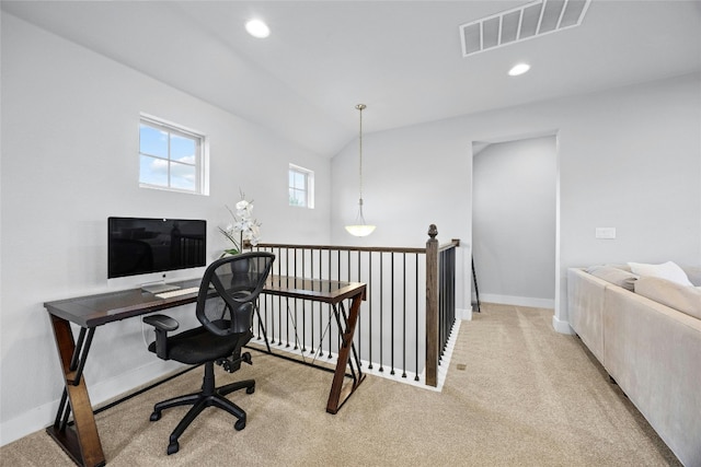 office with light carpet and vaulted ceiling